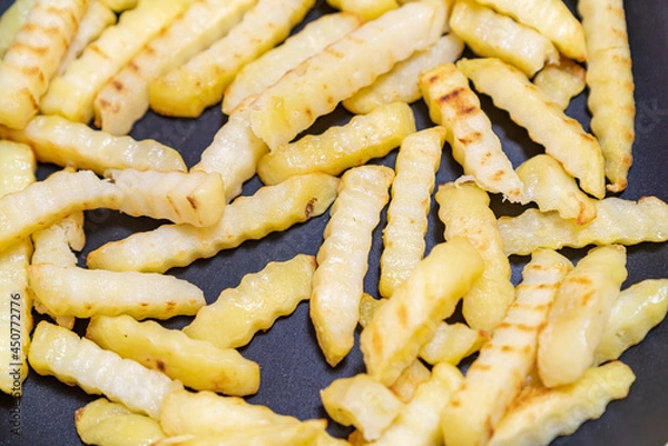 Fototapeta 美味しそうなフライドポテトの写真。高カロリーの食べ物の写真。