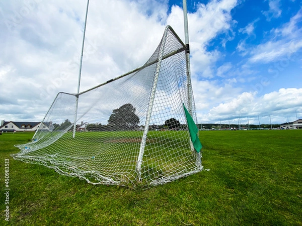 Fototapeta A Gaelic games goal on a summer cloudy day with nobody on the pitch