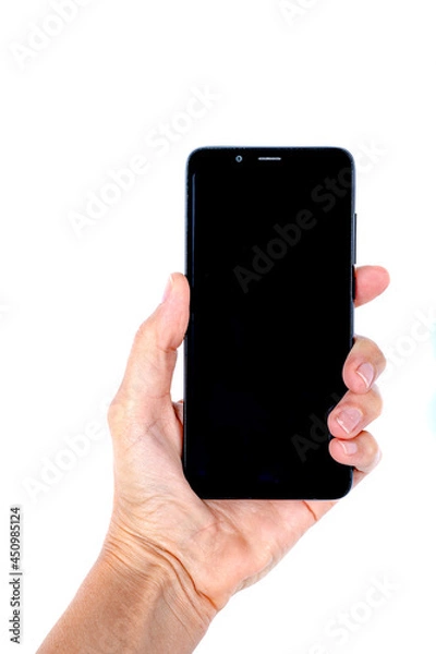 Fototapeta Close view of a woman hand holding a cell phone on a white background.