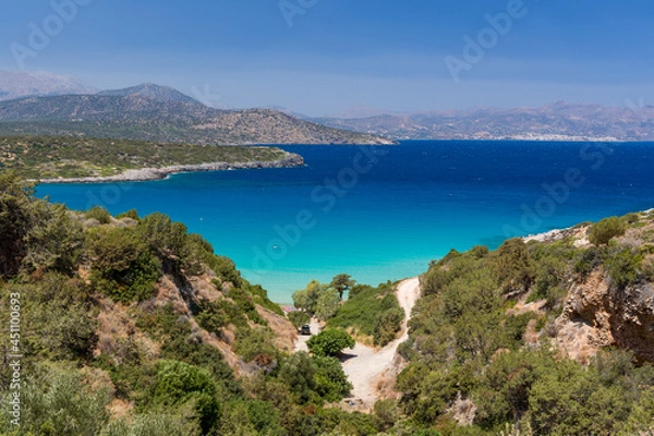 Fototapeta Beautiful clear, warm ocean and dry, summer coastline at Voulisma, Crete, Greece