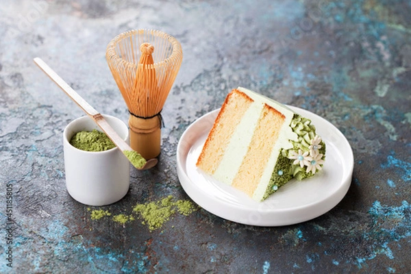 Obraz Slice of cake. Matcha Green Tea Cream cake. Almond lemon sponge or chiffon cake on a plate, selective focus