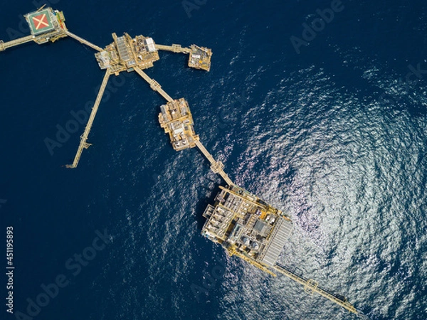 Fototapeta Central processing platform (cpp) in the middle of the ocean on sunny day - upstream industry.
