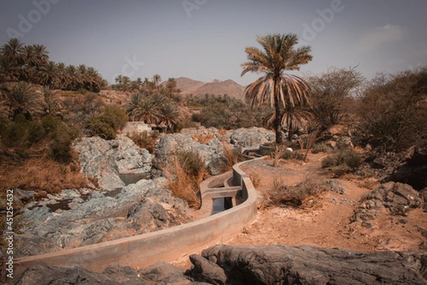 Obraz Wadi Al Hoqain village with Date palms in rustaq, oman.