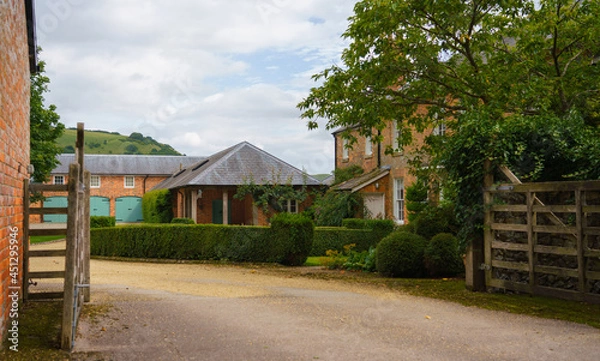Fototapeta Georgian style architecture of Manor Farm in the small village of Huish on the South facing edge of the Marlborough Downs, adjacent to Pewsey Vale, Wiltshire UK
