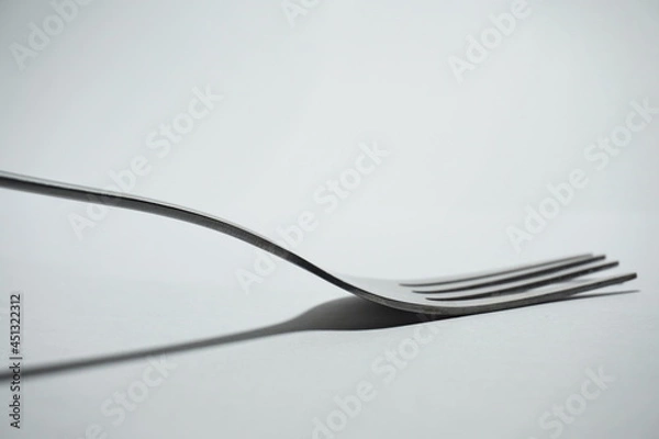 Fototapeta a fork on a white background