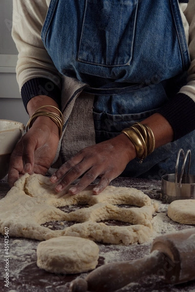 Obraz Woman making biscuits in her kitchen
