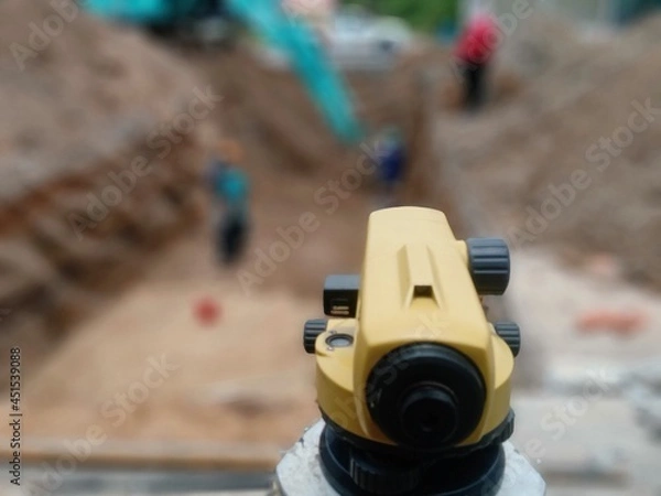 Fototapeta Blur image, survey work to level. lay down the drain