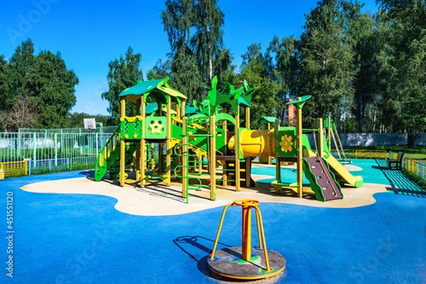 Fototapeta playground to play with a slide and stairs