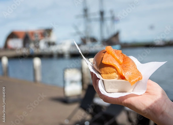 Fototapeta Portion of salmon sandwich sold in The Netherlands as a street snack food and called broodje zalm (in dutch)