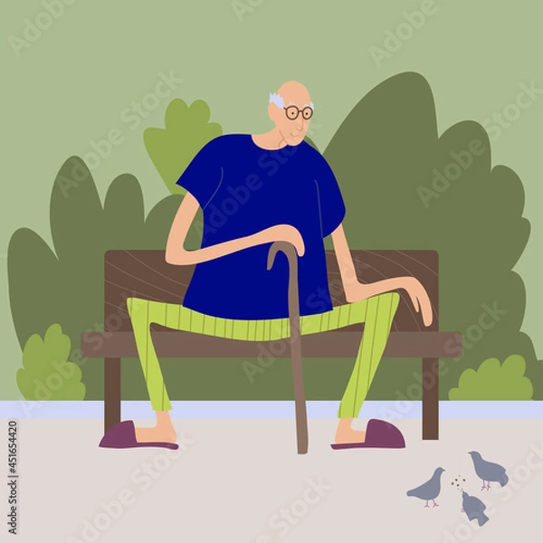 Fototapeta A cute old man feeds pigeons on a bench in the park. An elderly man in glasses with a cane and slippers.