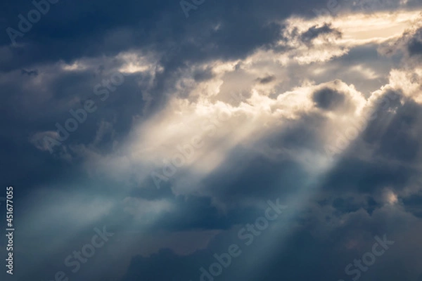 Fototapeta Sun shining through thick clouds. Bright view of natural colorful background.
