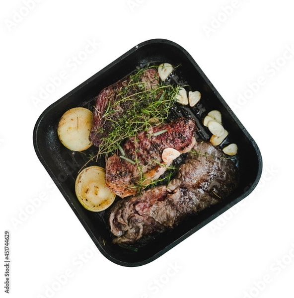 Fototapeta steak top view on frying pan cooking