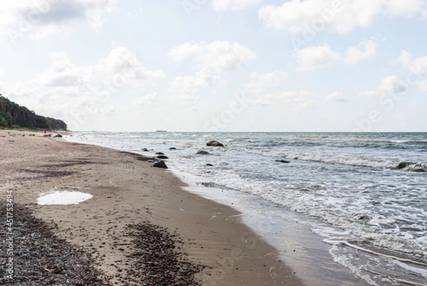Obraz Empty Beautiful sandy beach with a few tourists.Blue sky,clouds.Summer day.