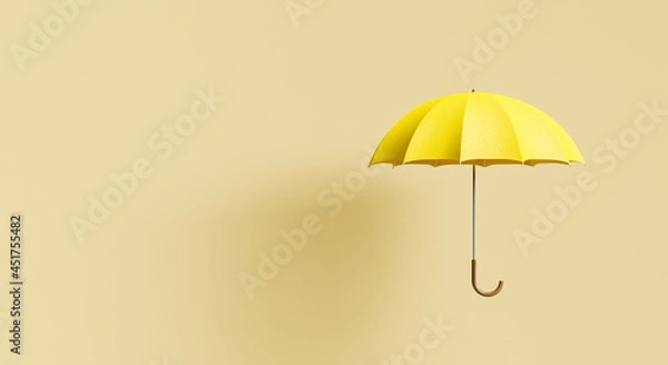 Fototapeta yellow umbrella on beige background with shadow