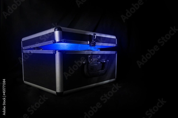 Obraz case with combination lock on black background