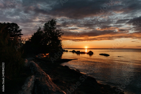 Obraz Photo of a Summer Sunset on the Lake. Travel location of popular tourist outdoor. View of beautiful Sea Landscape. Relax vacation near water