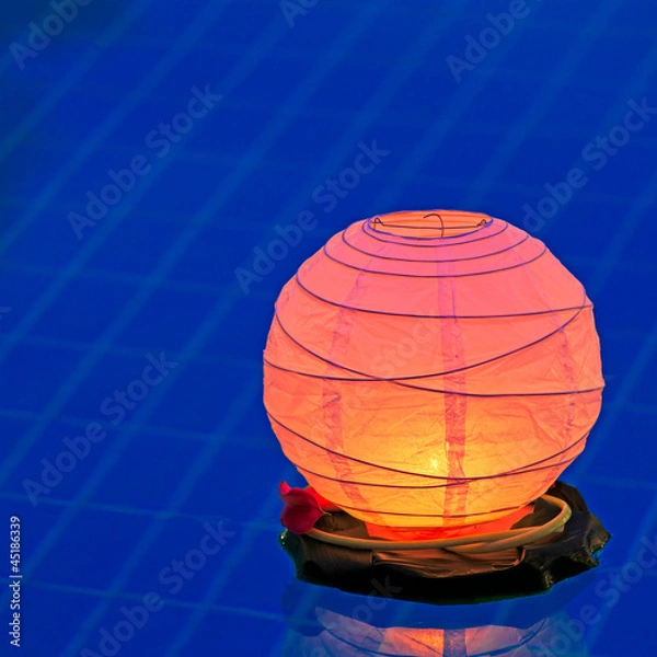 Obraz Floating water lantern in the pool