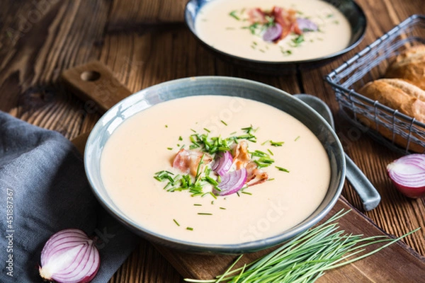 Fototapeta Demikat, classic Slovakian creamy sheep cheese soup topped with roasted bacon and fresh chives