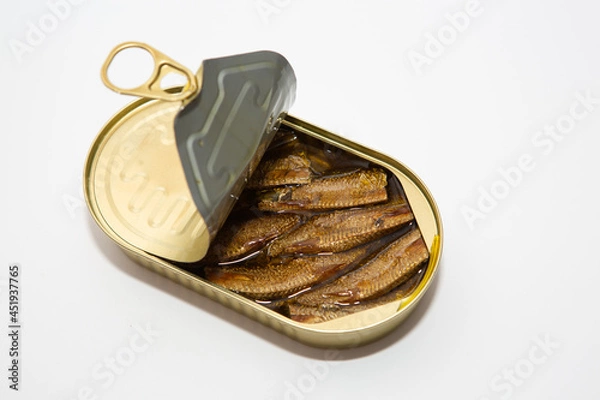 Fototapeta sprats in a tin can on a white background
