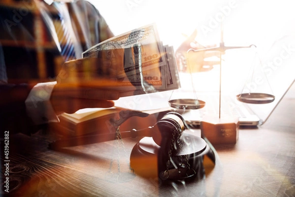 Fototapeta Business and lawyers discussing contract papers with brass scale on desk in office. Law, legal services, advice, justice and law concept picture with film grain effect
