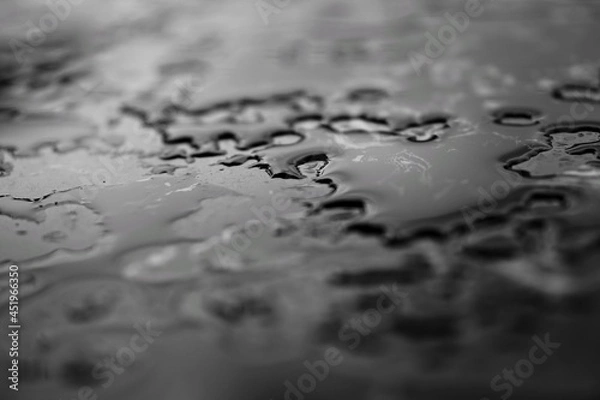 Obraz Black and white photo of water drop surface on black marble.