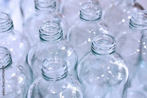 Obraz Close up of clean empty glass bottles for packing and contain.   