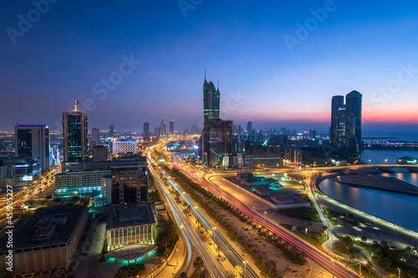 Obraz Aerial view of Manama skyline after sunset and newly constructed modern buildings with beautiful lights.