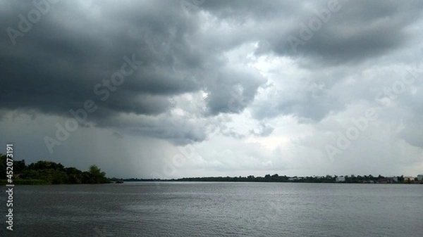 Fototapeta the appearance of a cloudy sky over the river and cloudy clouds
