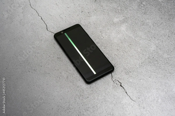 Fototapeta smartphone with a damaged screen with a color stripe. burnt out pixels.