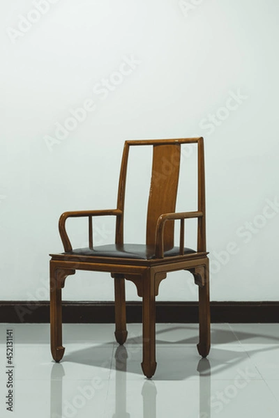Fototapeta Vintage leather armchairs comfortable brown luxury leather with wall in antique house interior for decoration house and living building.  Retro chair design concept.