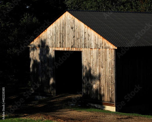 Obraz old barn in shadows