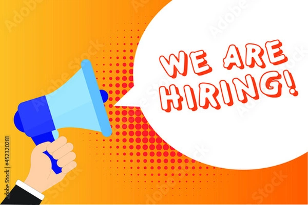 Fototapeta Male hand holding megaphone with We are Hiring! speech bubble. Loudspeaker. Banner for business, marketing and advertising. Vector illustration.