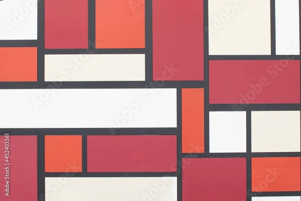 Fototapeta A view of a wall with different shaped square and rectangles in different colors, as a background.