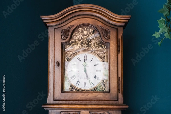 Obraz an antique clock on a background