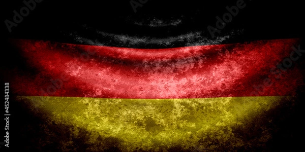 Fototapeta Germany wavy flag in grunge style with darkened edges. Old texture