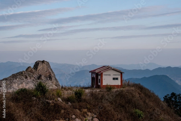 Fototapeta Blue sky and white clouds, all kinds of stones and plants on the mountain