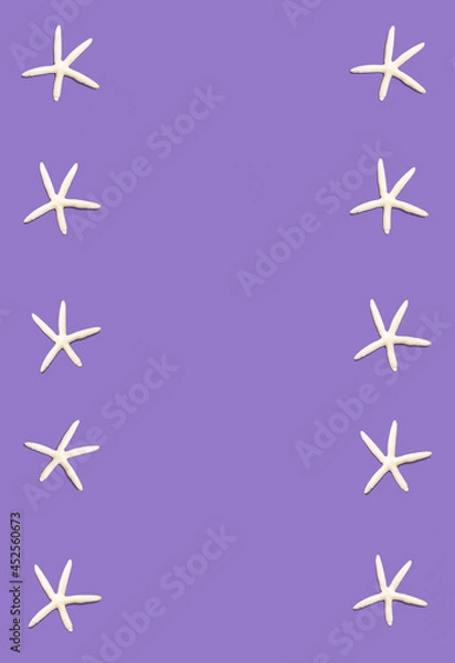 Fototapeta Pattern made of white starfishes  against violet pastel glazed background. Minimal summer sunlit fun concept.