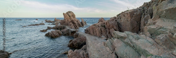 Fototapeta Panoramic view of the runway known as the bridges way in Canyet Creek between rocks and the mediterranean sea