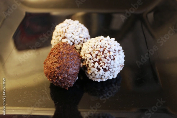 Obraz chocolate sweets on black background 