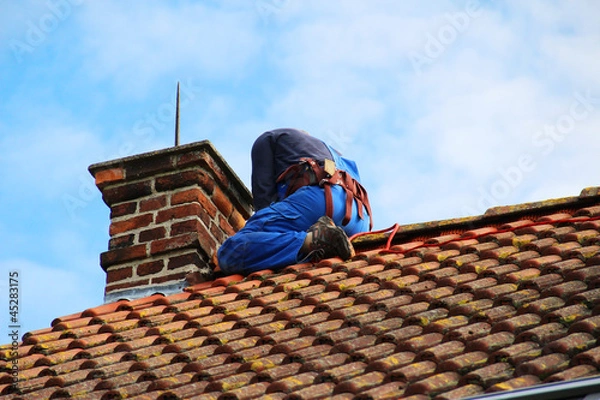 Fototapeta Arbeiter auf dem Dach