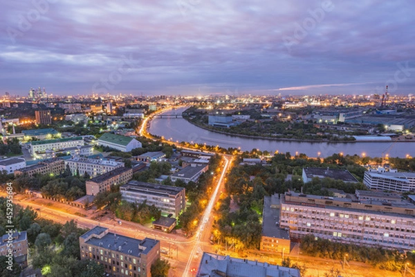 Fototapeta Aerial city view by the river at sunset. Moscow.