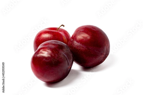 Obraz red plums isolated on white background