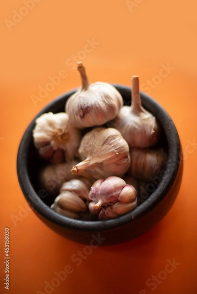 Obraz Garlic (on orange background) 