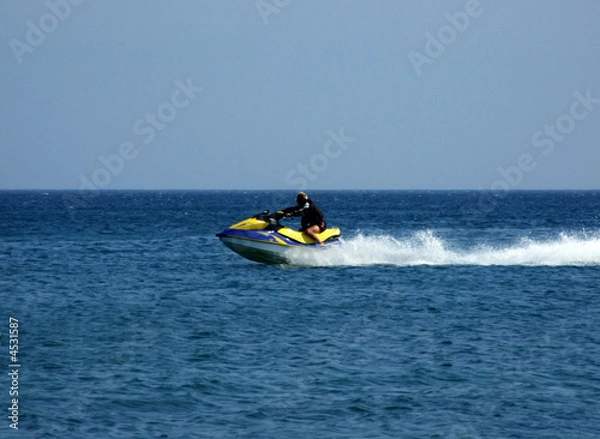 Obraz The men goes for a drive on a wave runner on sea waves 1