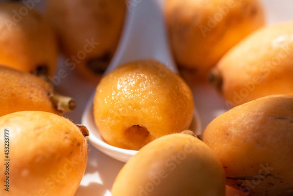 Obraz Loquats on the plate under the sun