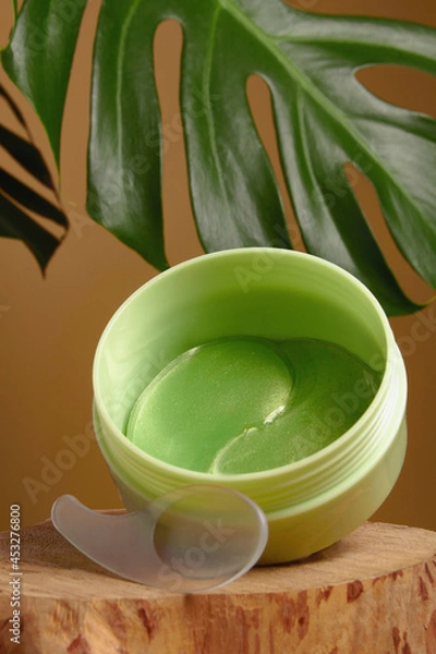 Fototapeta green tea eye patches to reduce puffiness and bruising under the eyes. flatlay.  the concept of self-care