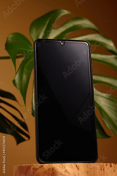 Fototapeta Mobile smart phone on color background. technology