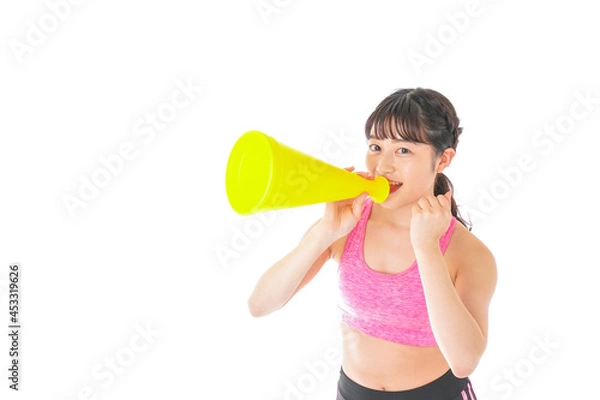 Fototapeta スポーツウェアで応援する若い女性