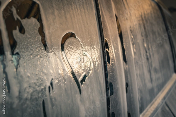 Obraz Drawn heart on blurred car glass. Close-up.