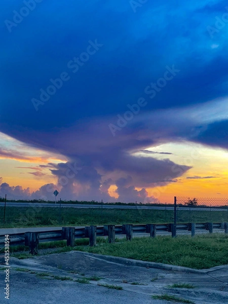 Obraz Swamp sunset and hurricane clouds